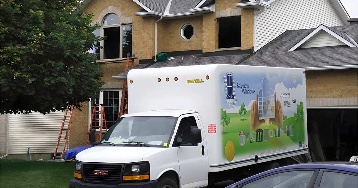 image of house and Bayview Windows truck out in front - windows being installed