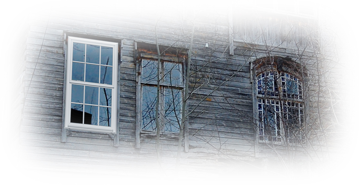 image showing a new window beside a battered up aging window