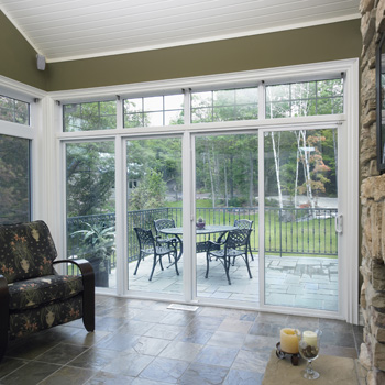 image of quadruple sliding patio door with a view into the backyard