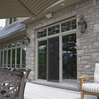 Image of triple sliding patio door from deck